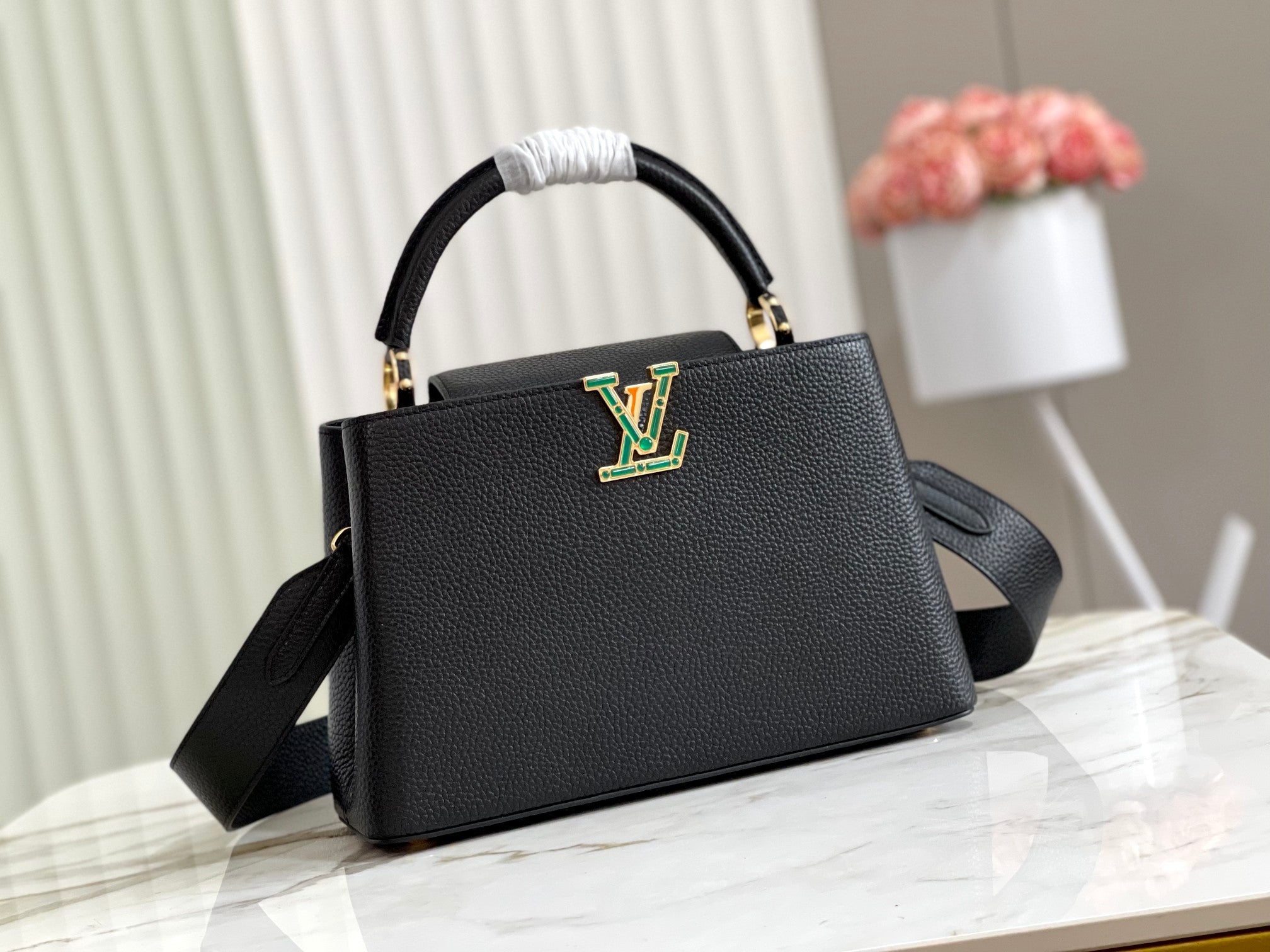 Capucines Medium Black Taurillon Leather Handbag with Malachite Green Accent