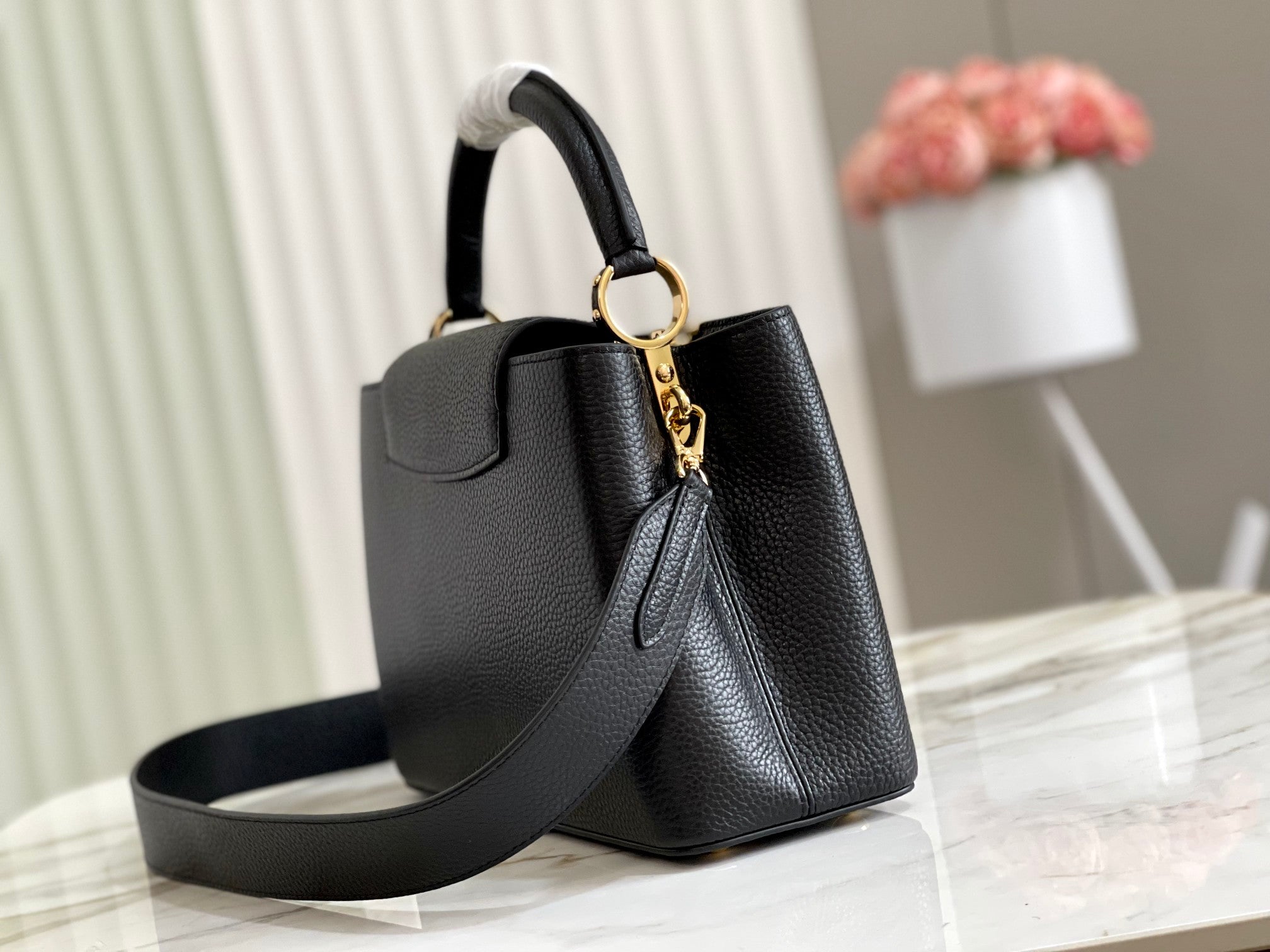 Capucines Medium Black Taurillon Leather Handbag with Malachite Green Accent