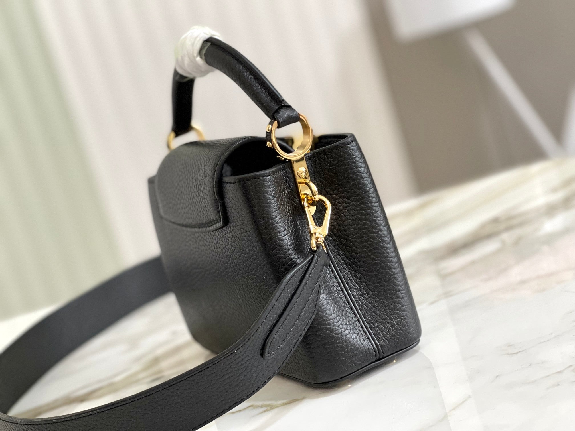 Capucines Mini Handbag in Black with Malachite Green Accents