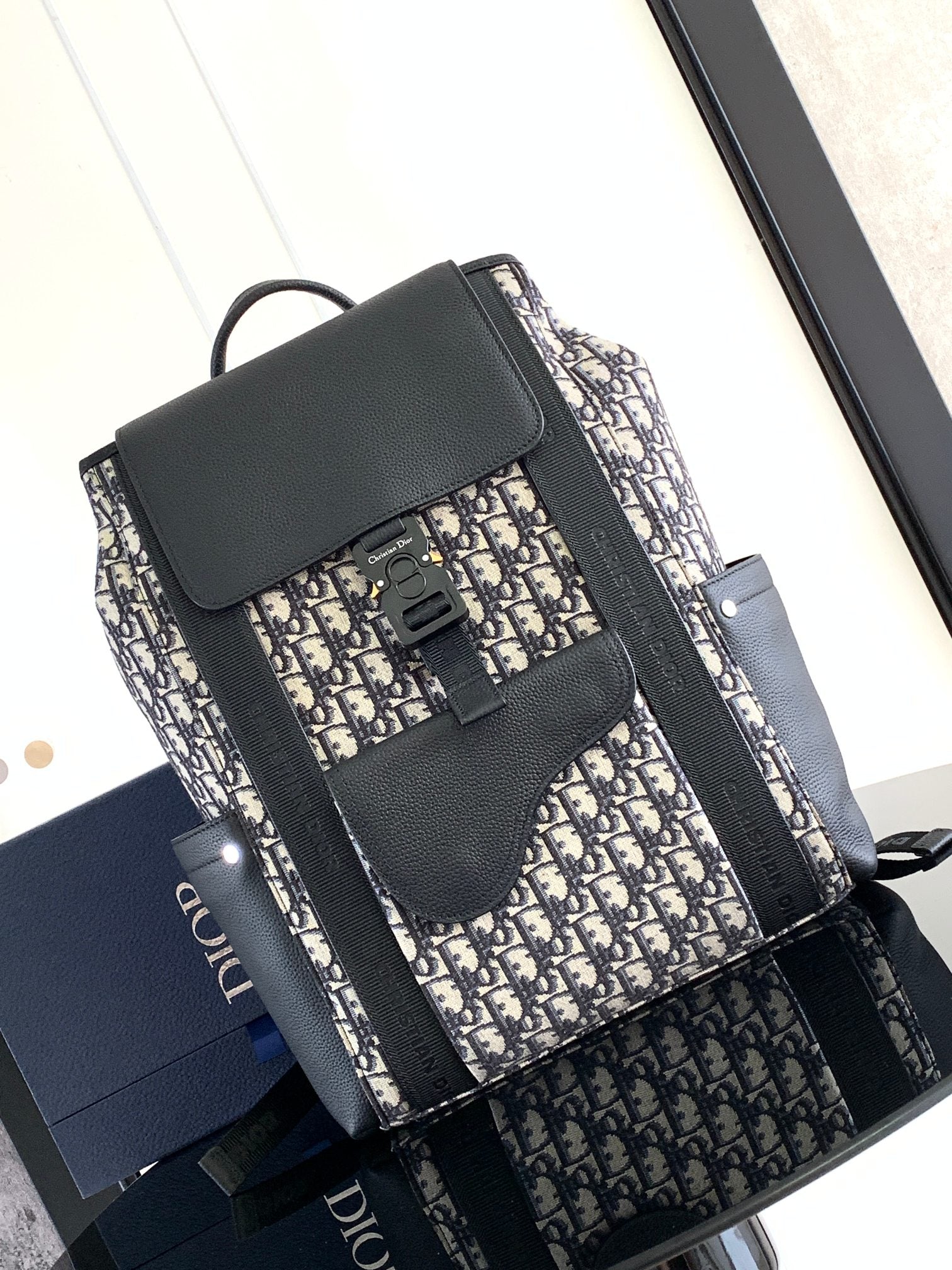 Elegant Beige and Black Oblique Print Saddle Backpack