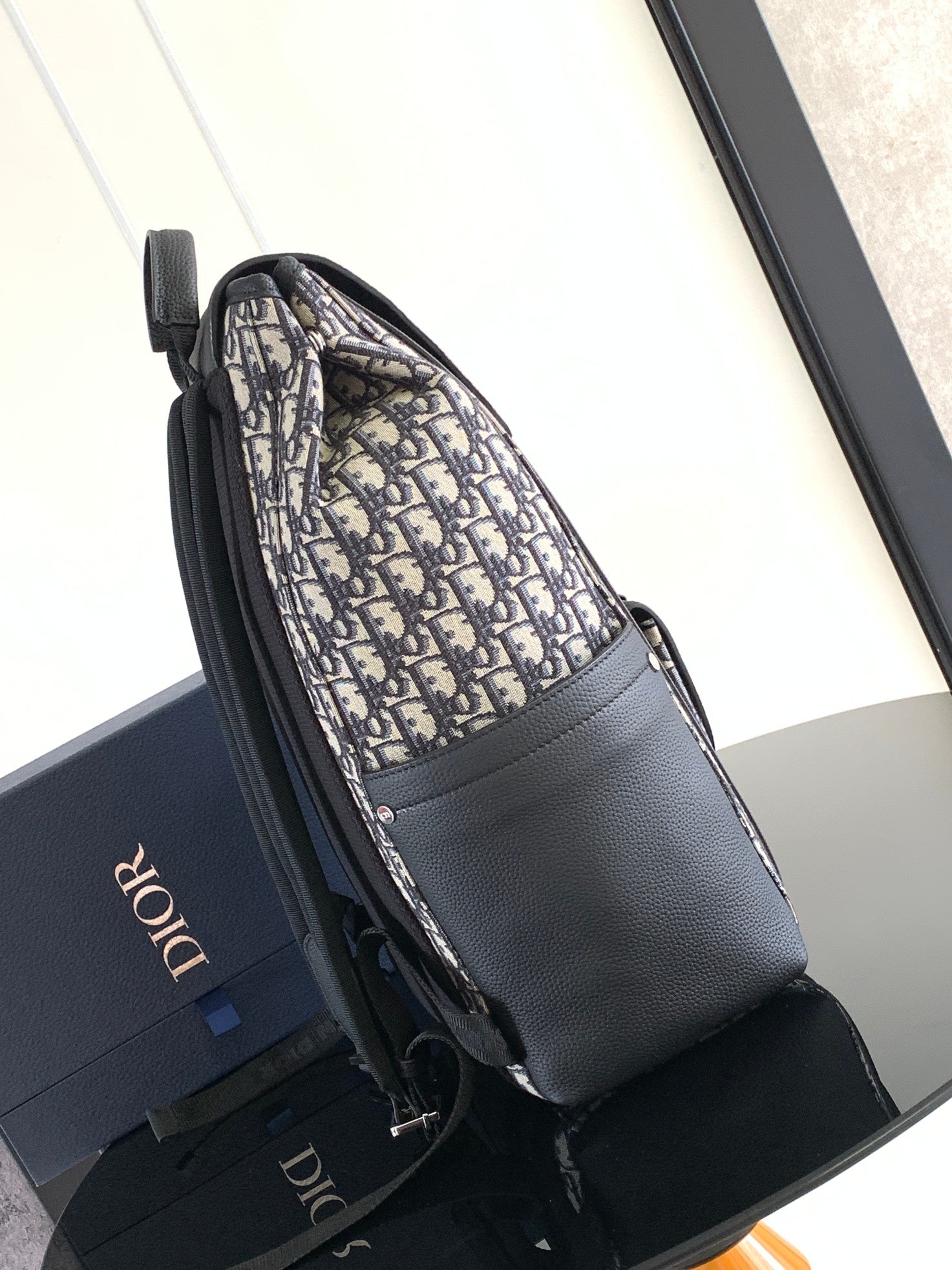 Elegant Beige and Black Oblique Print Saddle Backpack