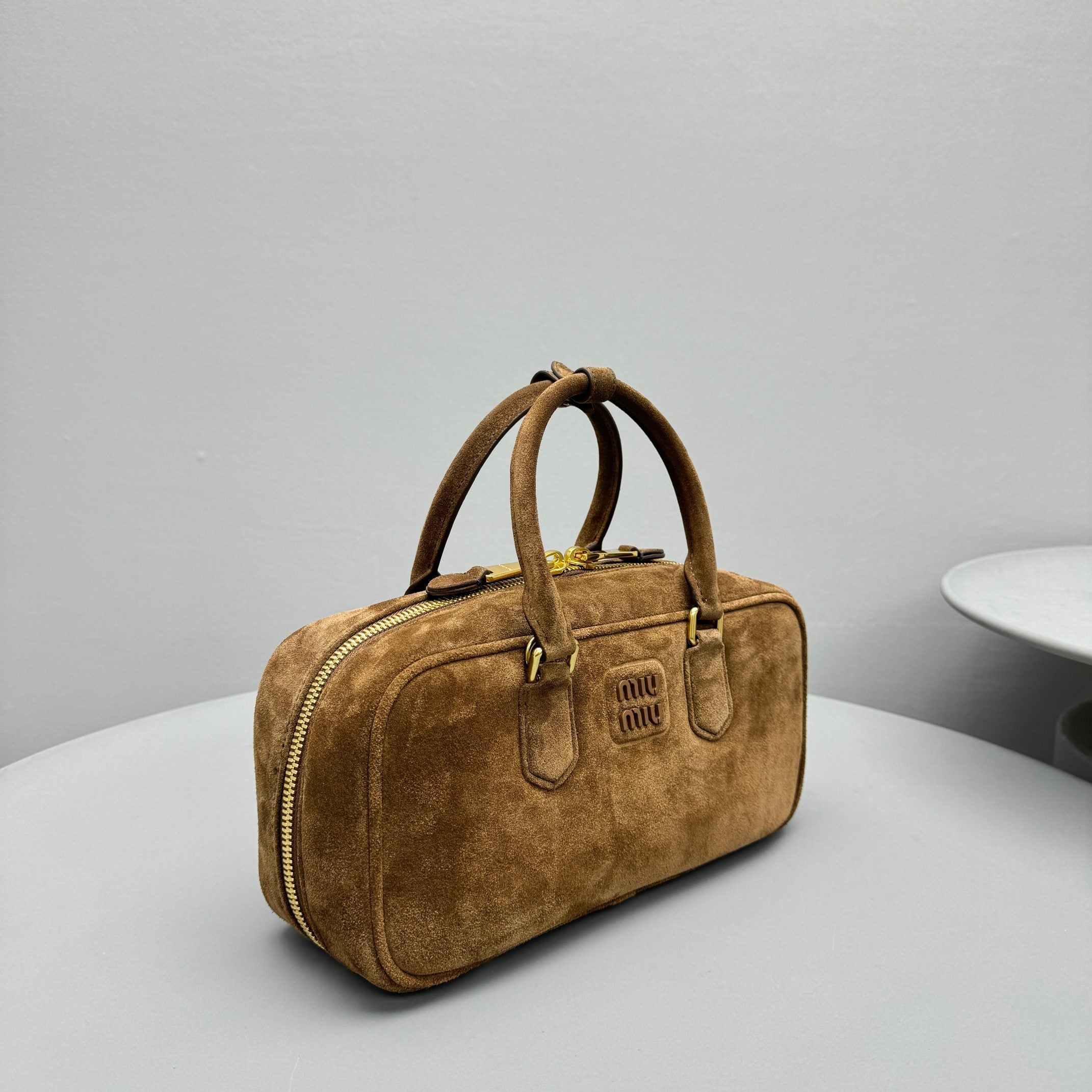 ** Miu Retro Frosted Dark Brown Small Square Bag

**