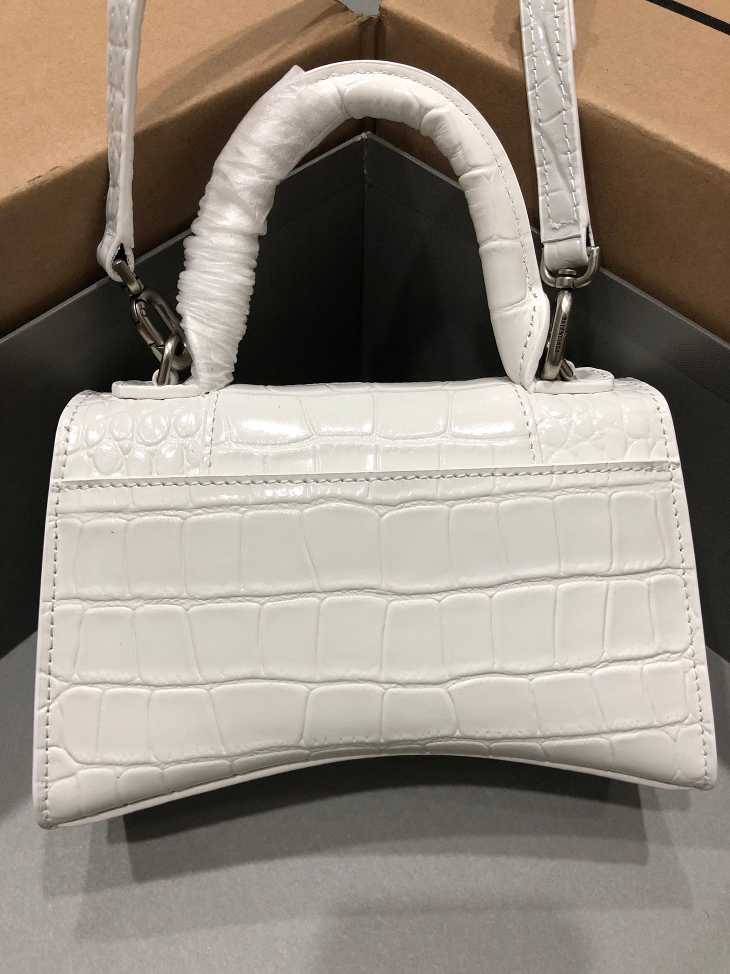 ** Balenciaga Hourglass Bag with Crocodile Print and Silver Buckle

**