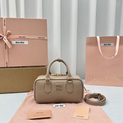 MIUMI SS23 Soft Padded Bowling Bag in Bean Paste Color