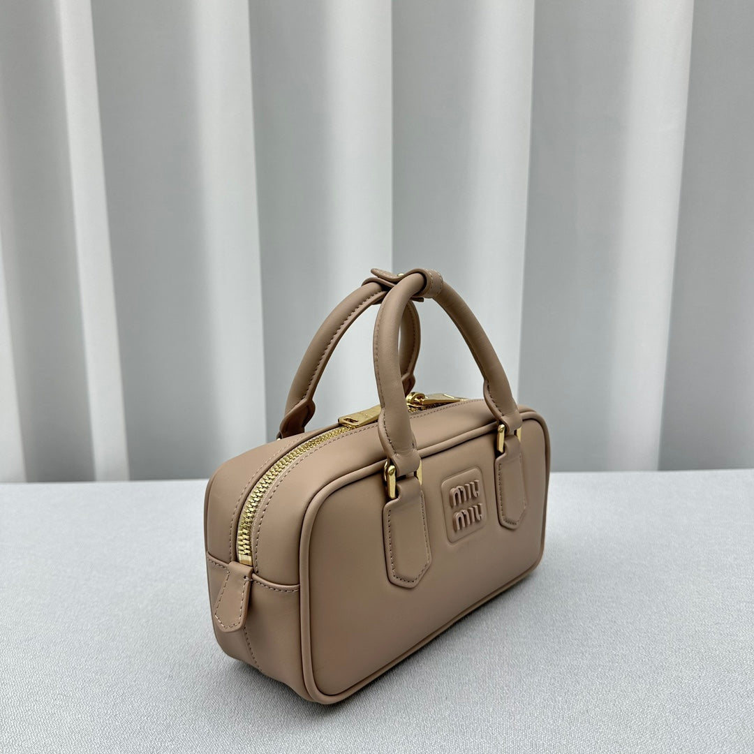 MIUMI SS23 Soft Padded Bowling Bag in Bean Paste Color