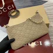 Gucci GG Emblem Small Shoulder Bag in Beige Grained Leather